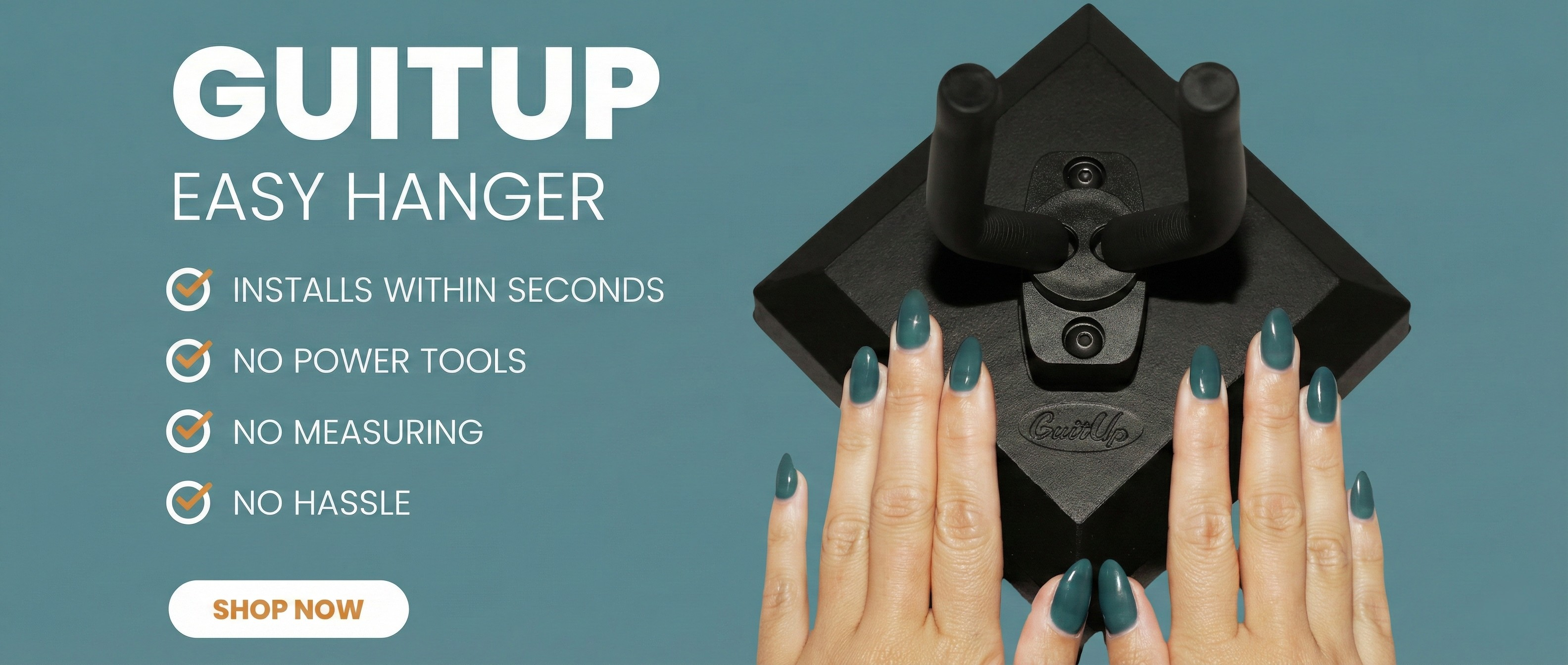 Advertisement for Guitup Easy Hanger, a black wall-mounted guitar stand, with hands showing it. Text lists features: Installs within seconds, no power tools, no measuring, no hassle. Shop Now button below.